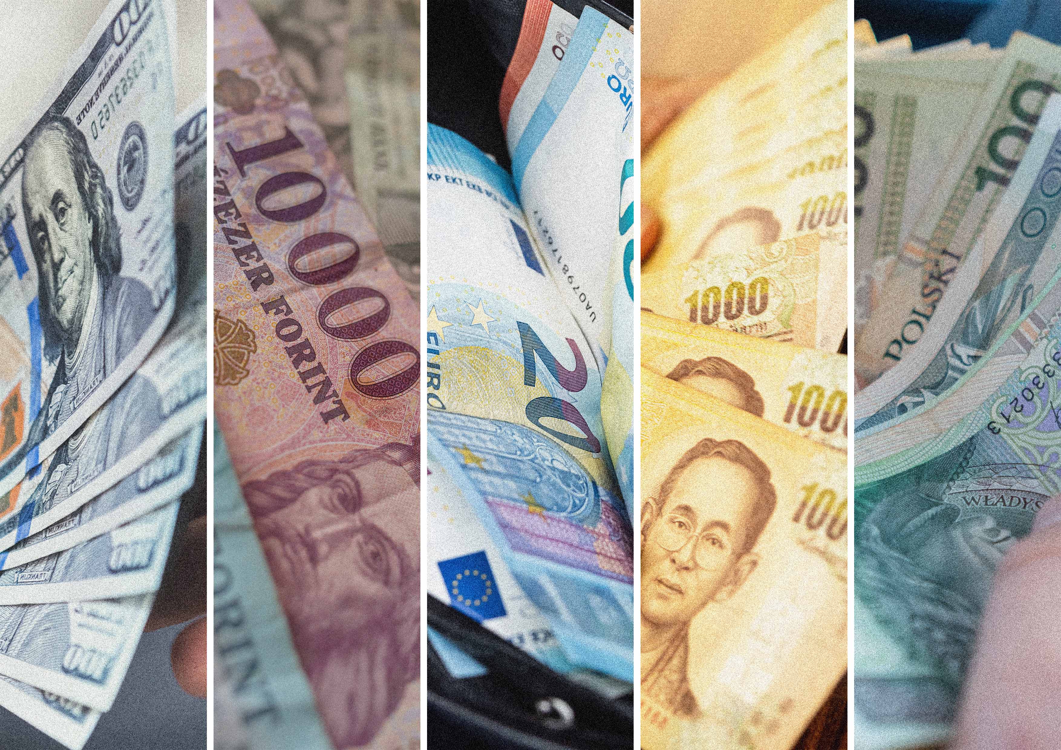 Close-up of banknotes in different currencies – US dollars, euros, Thai baht, Hungarian forint and Polish zloty – arranged side by side