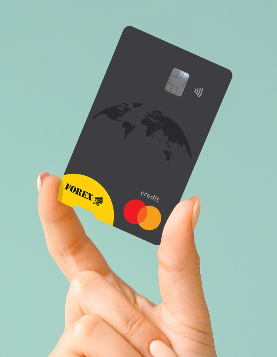 Hand holding a black FOREX Credit Card with Mastercard logo against a green background.