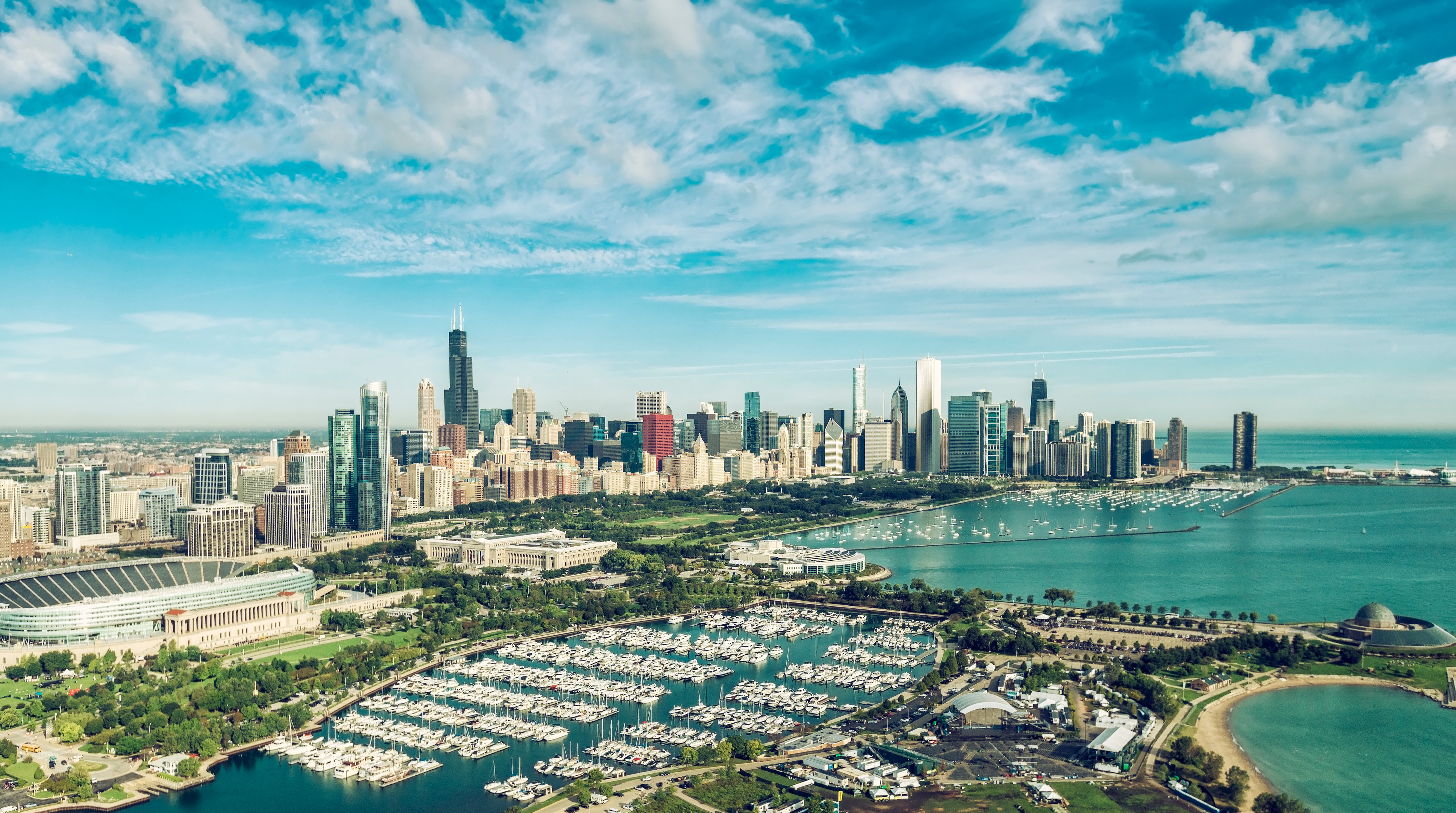 Panoramic view of Chicago skyline with Willis Tower, Navy Pier, and Lake Michigan on a clear day